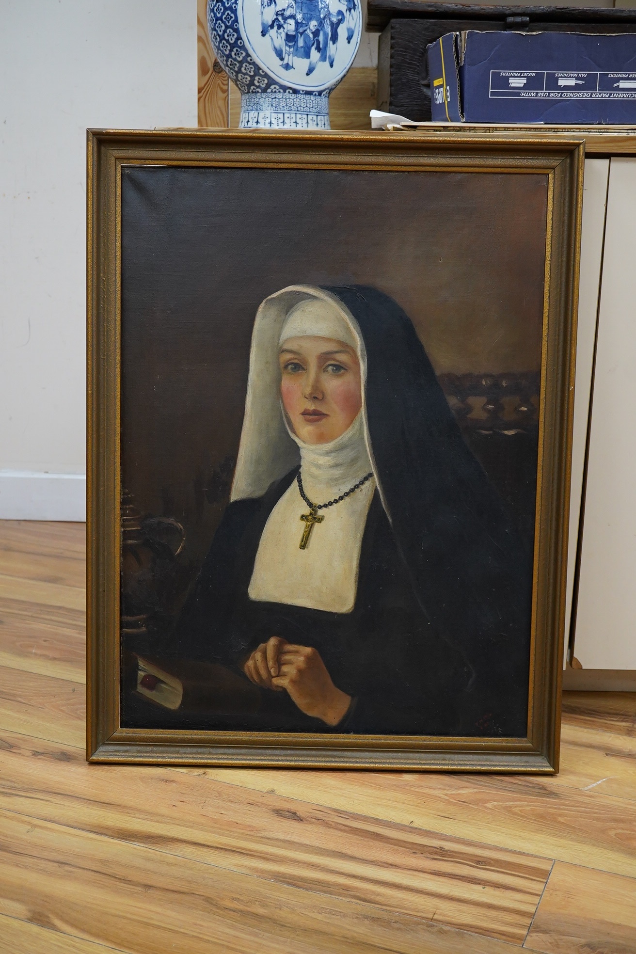 Early 20th century School, oil on canvas, Portrait of a nun, indistinctly signed lower right, 68 x 50cm. Condition - fair